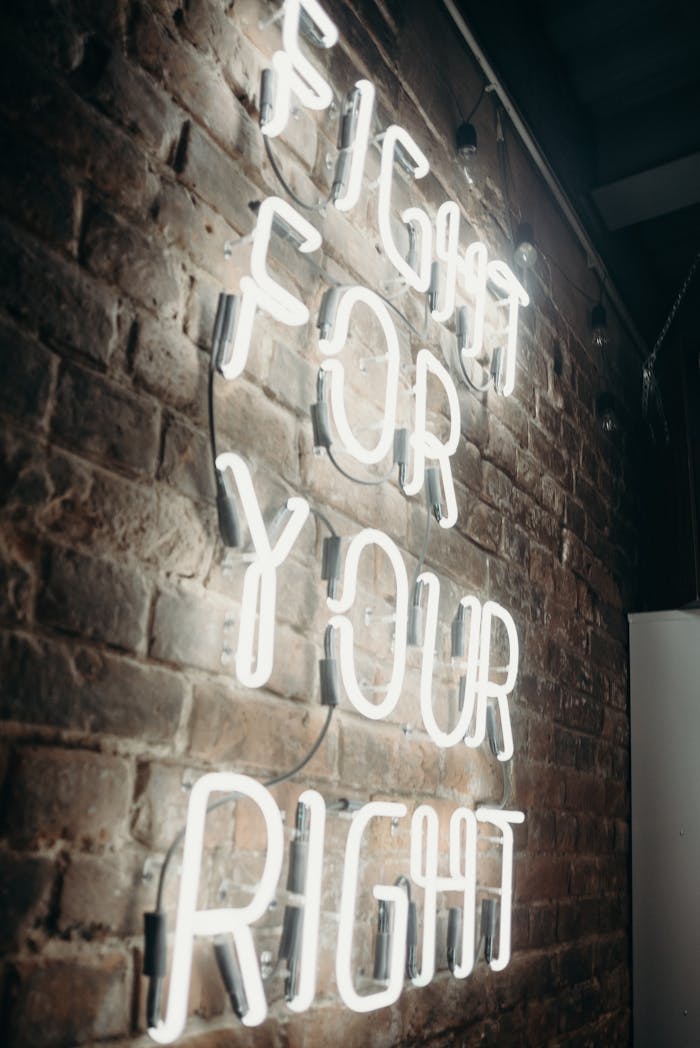 my-path Neon light on brick wall displaying the phrase 'Fight For Your Right' offering a motivational message.